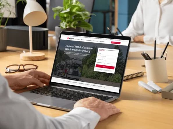 Get an instant and free car shipping quote online customer using a laptop to get an instant car shipping quote on the website